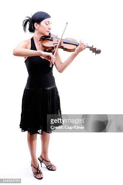 violinist playing her violin - violinist stock pictures, royalty-free photos & images