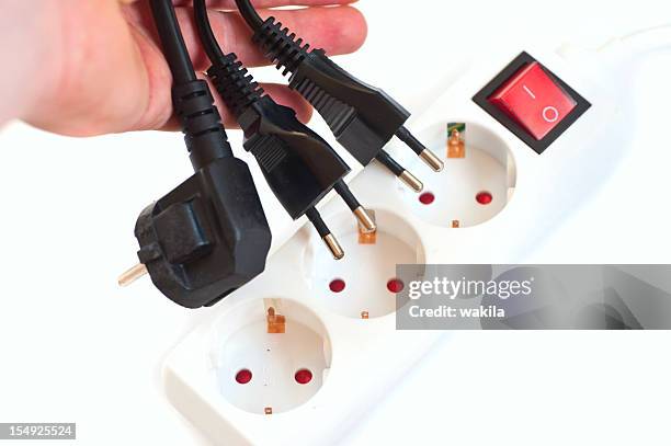 switch off the outlet - stom save the plug pull - plug socket stock pictures, royalty-free photos & images