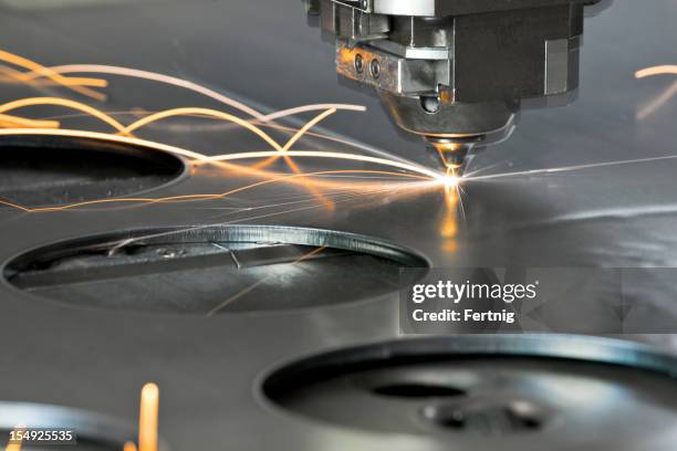 laser metal cutting manufacturing tool in operation - cnc maschine stock pictures, royalty-free photos & images