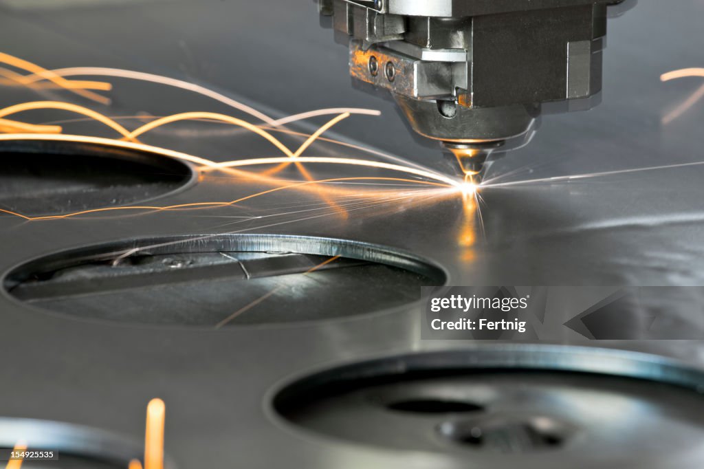 Laser metal cutting manufacturing tool in operation