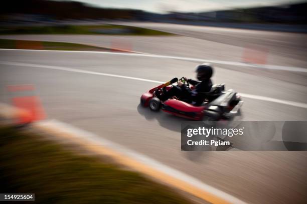 competitive go-cart racing blurred - go carting stock pictures, royalty-free photos & images