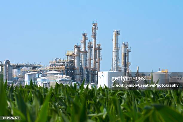 ethanol plant by corn field - biofuel stock pictures, royalty-free photos & images