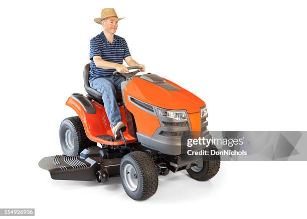 man on a lawn tractor - riding lawnmower stock pictures, royalty-free photos & images