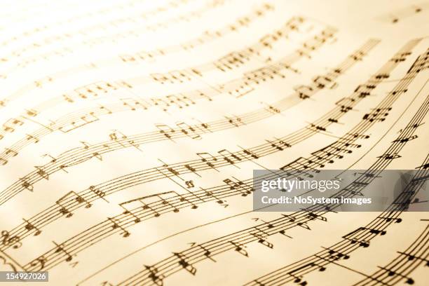 sheet of musical symbols - bladmuziek stockfoto's en -beelden