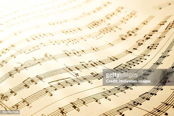 sheet of musical symbols - sheet music stock pictures, royalty-free photos & images