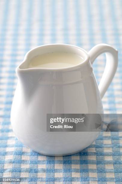 a jug of cream - milchkrug stock-fotos und bilder