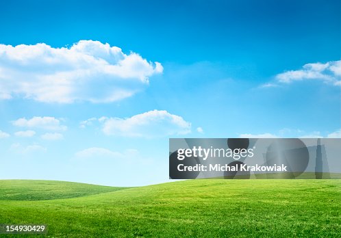 Digital composition of green meadow and blue sky Digital composition of green meadow and blue sky