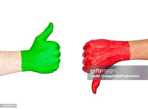 two hands one painted green and the other red showing signs - 邪惡 個照片及圖片檔