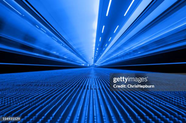 blue travelator - manchester airport stock pictures, royalty-free photos & images