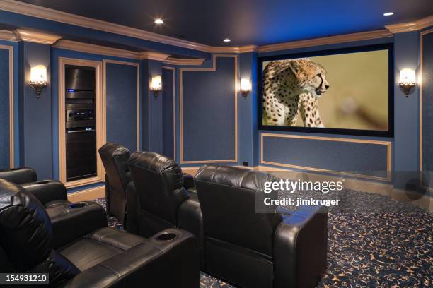 black leather chairs adorn a beautiful home theatre. - man cave stock pictures, royalty-free photos & images