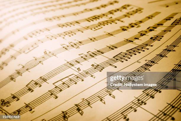 sheet of musical symbols - sheet music stock pictures, royalty-free photos & images