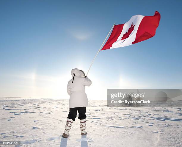 arctic sundog or parhelion and canadian flag. - polar climate stock pictures, royalty-free photos & images