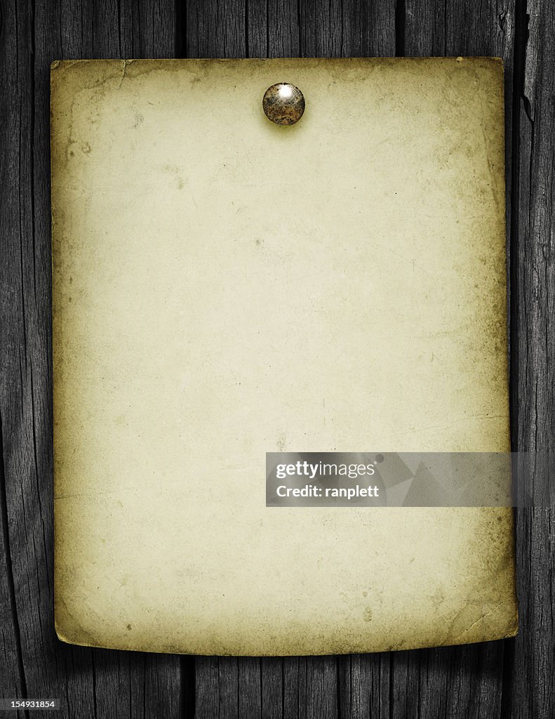 Blank Grungy Paper Tacked to a Wood Post