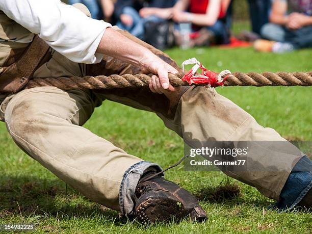 lead man in tug of war contest - the 2011 braemar highland games stock pictures, royalty-free photos & images