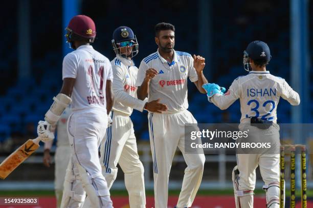 Ravichandran Ashwin and Yashasvi Jaiswal , of India, celebrate the dismissal of Kraigg Brathwaite , of West Indies, during the fourth day of the...