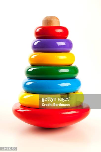 colorful stacked round wooden circles  - baby isolated stockfoto's en -beelden