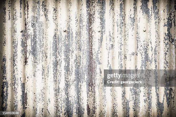 damaged corrugated metal surface background - roof texture stock pictures, royalty-free photos & images