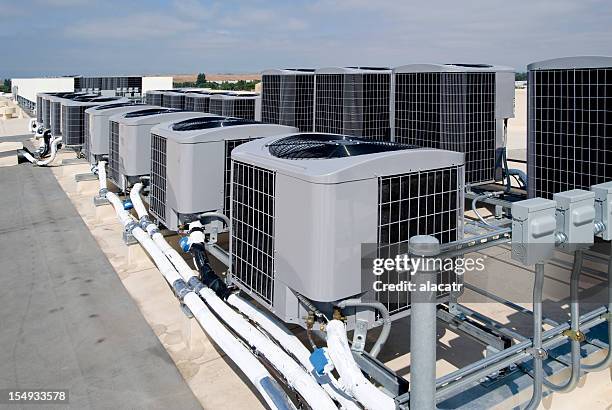 high efficiency air conditioners. - rooftop hvac stock pictures, royalty-free photos & images