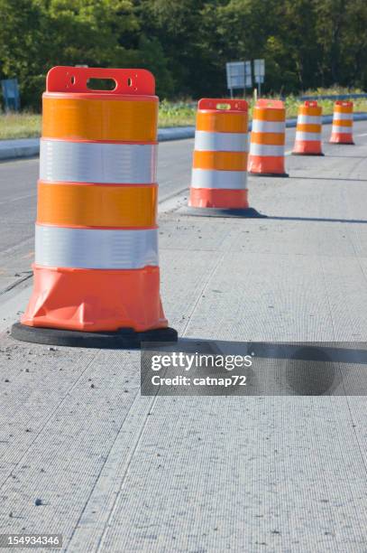 orange barrels in highway maintenance, repair, construction zone - road construction zone stock pictures, royalty-free photos & images