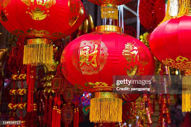 multiple asian hanging red lanterns - spring fete stock pictures, royalty-free photos & images