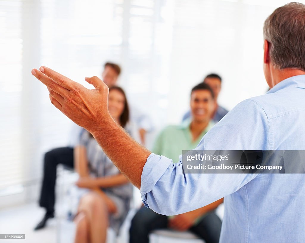 Business man speaking on presentation