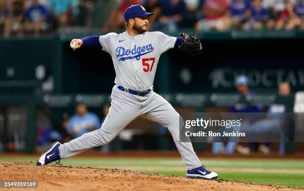 Ryan Brasier of the Los Angeles Dodgers pitches against the Texas Rangers during the seventh inning of the game at Globe Life Field on July 23, 2023...