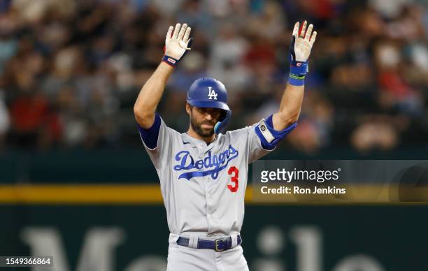 Chris Taylor of the Los Angeles Dodgers celebrates after hitting a double against the Texas Rangers during the eighth inning at Globe Life Field on...