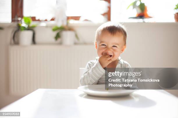 the boy and the pea - baby eating stock pictures, royalty-free photos & images