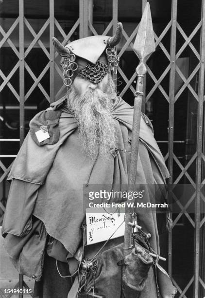 Portrait of blind American composer, musician, poet, and eccentric Moondog as he stands outside the Underwriters Trust Company doorway , New York,...