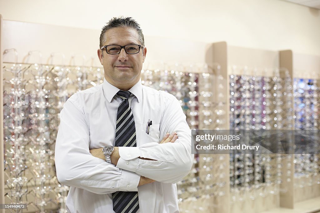 Optician in his shop