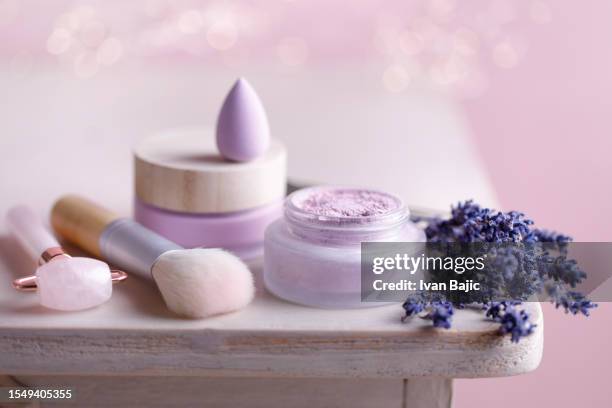 purple cosmetic products - sminkborste bildbanksfoton och bilder