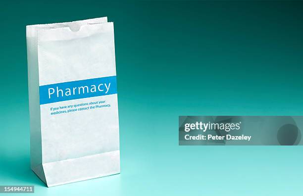 pharmacy prescription bag with copy space - prescription drug stock pictures, royalty-free photos & images