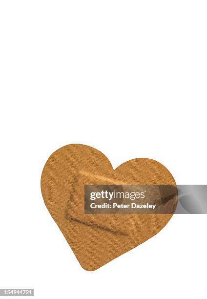 heart shaped sticking plaster - pleister stockfoto's en -beelden