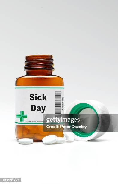 sick day pill bottle and pills - medicine bottle labels stock pictures, royalty-free photos & images