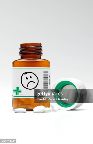 sad/unhappy face pill bottle and pills - anthropomorphic stock pictures, royalty-free photos & images