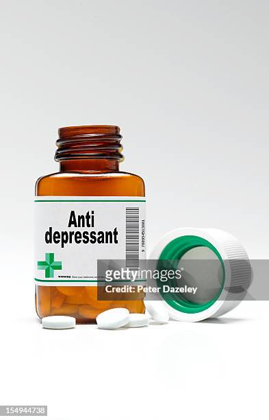 anti-depressant pill bottle and pills - prozac stock-fotos und bilder