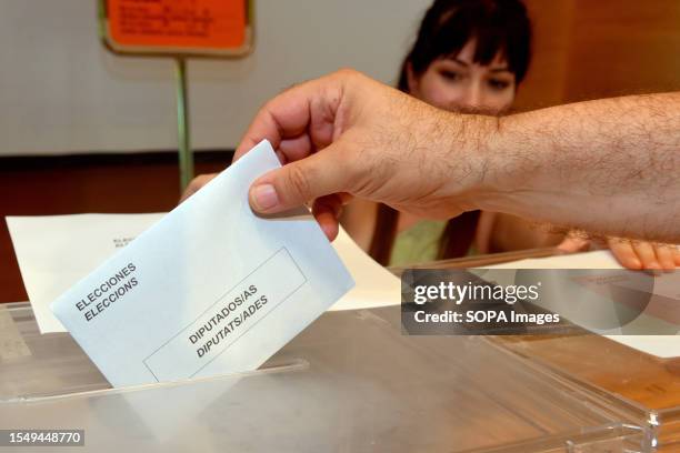 Man deposits a voting envelope in a ballot box for the deputies to the Congress during the General Elections in Vendrell. More than 37.5 million...
