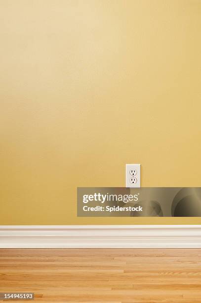 wall plug in empty room - wainscoting stock pictures, royalty-free photos & images