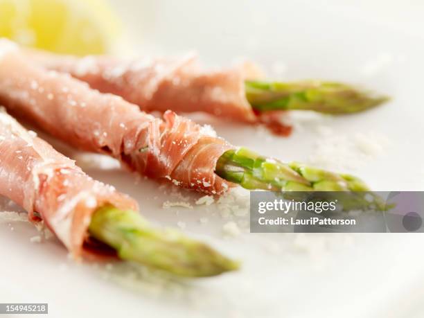prosciutto wrapped asparagus - prosciutto wrapped stock pictures, royalty-free photos & images