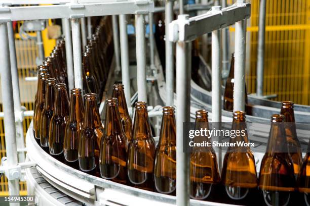 bottle manufacturing - beer flowing stock pictures, royalty-free photos & images