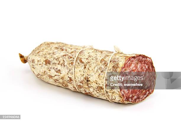 a singular salami sausage on white - salami stock pictures, royalty-free photos & images