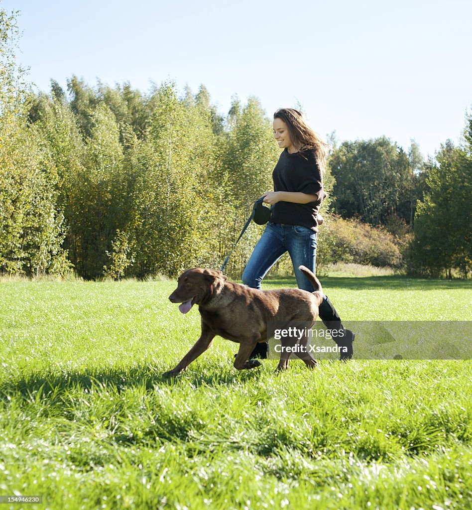 Young woman with labrador