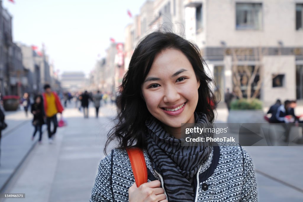 Happy Woman with Shopping Center Background - XLarge