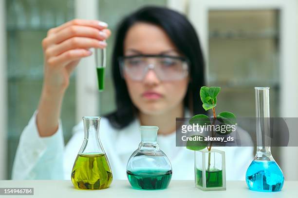 research - green potion stock pictures, royalty-free photos & images