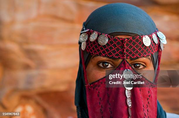 veiled bedouin woman in jordan - saudi bedouin stock pictures, royalty-free photos & images