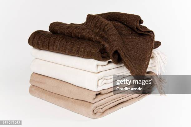 set of blankets that are beige white and brown - fleece stock pictures, royalty-free photos & images