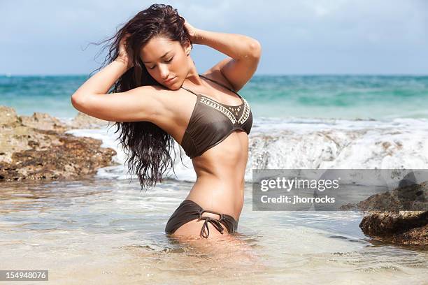 bathing beauty - latina glamour models stock pictures, royalty-free photos & images