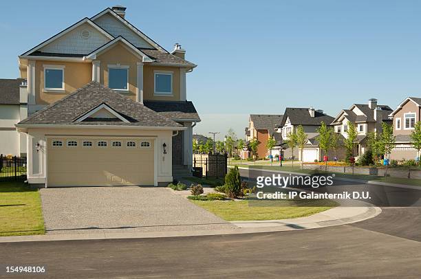 few brand new suburban houses. - suburban sidewalk stock pictures, royalty-free photos & images
