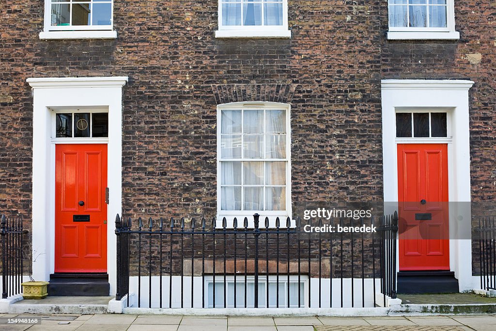 Brick Facade with Red Front Doors London England