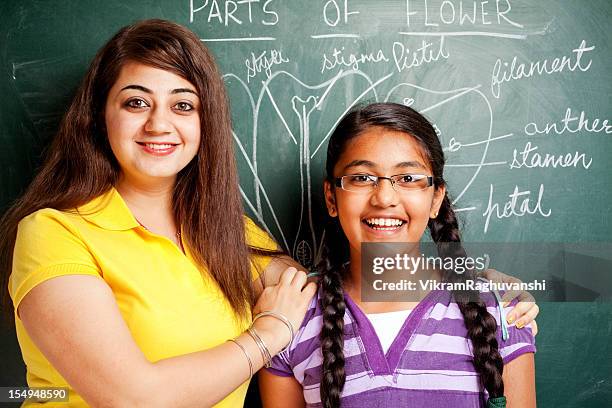 indian girl student teacher showing parts of flowers chalk drawing - showing appreciation stock pictures, royalty-free photos & images